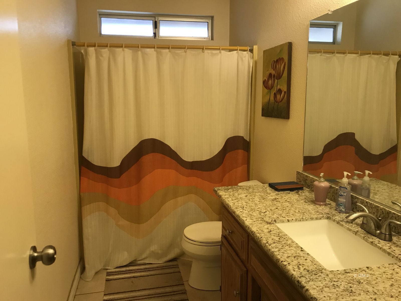 232 Apache Lane Ridgecrest, CA 93555 - Photo 11 of 19 a bathroom with a granite countertop sink and a mirror