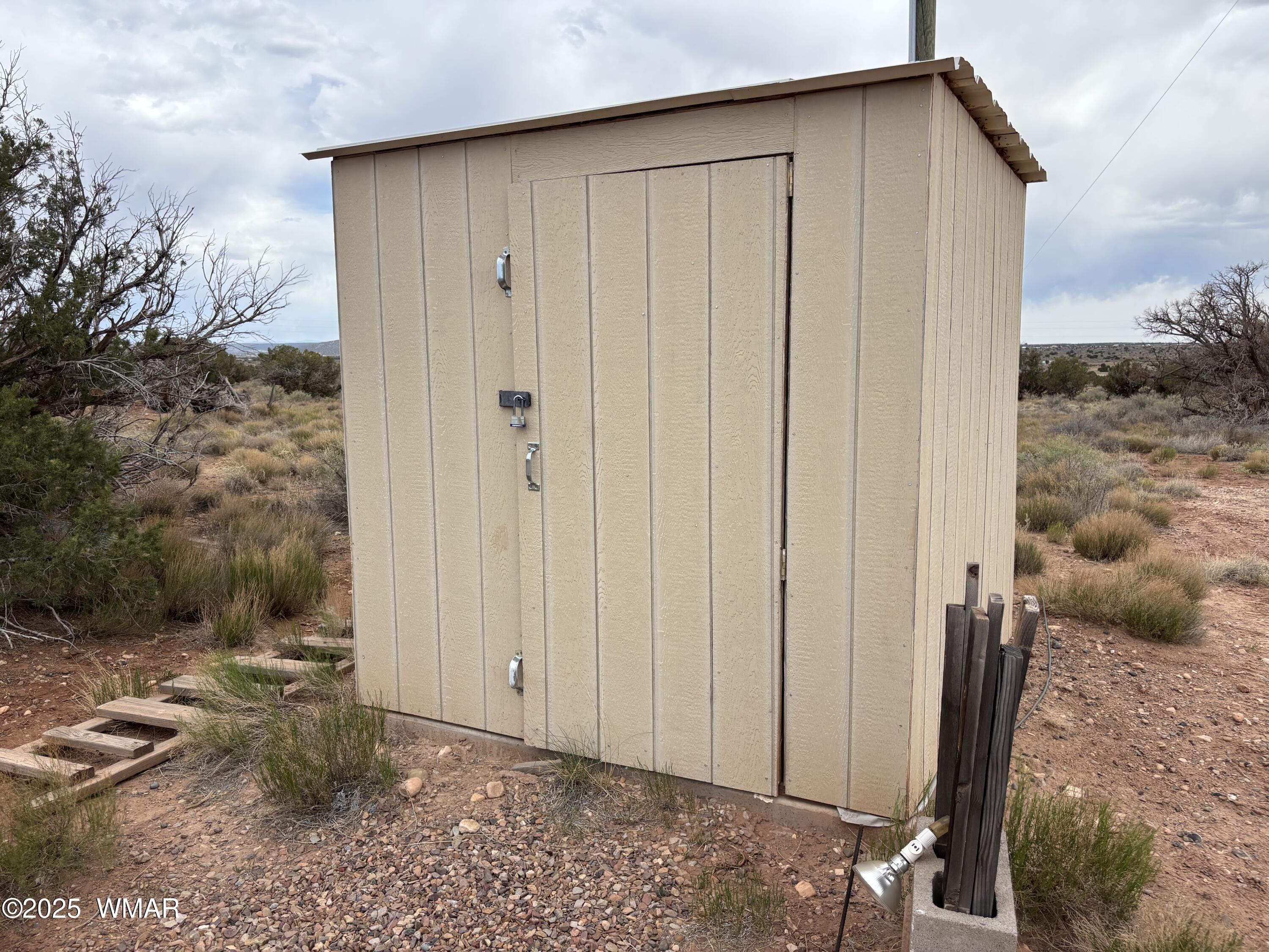 5233 Concho Ocho Road Snowflake, AZ 85937 - Photo 16 of 19 a view of a house with backyard space and a window