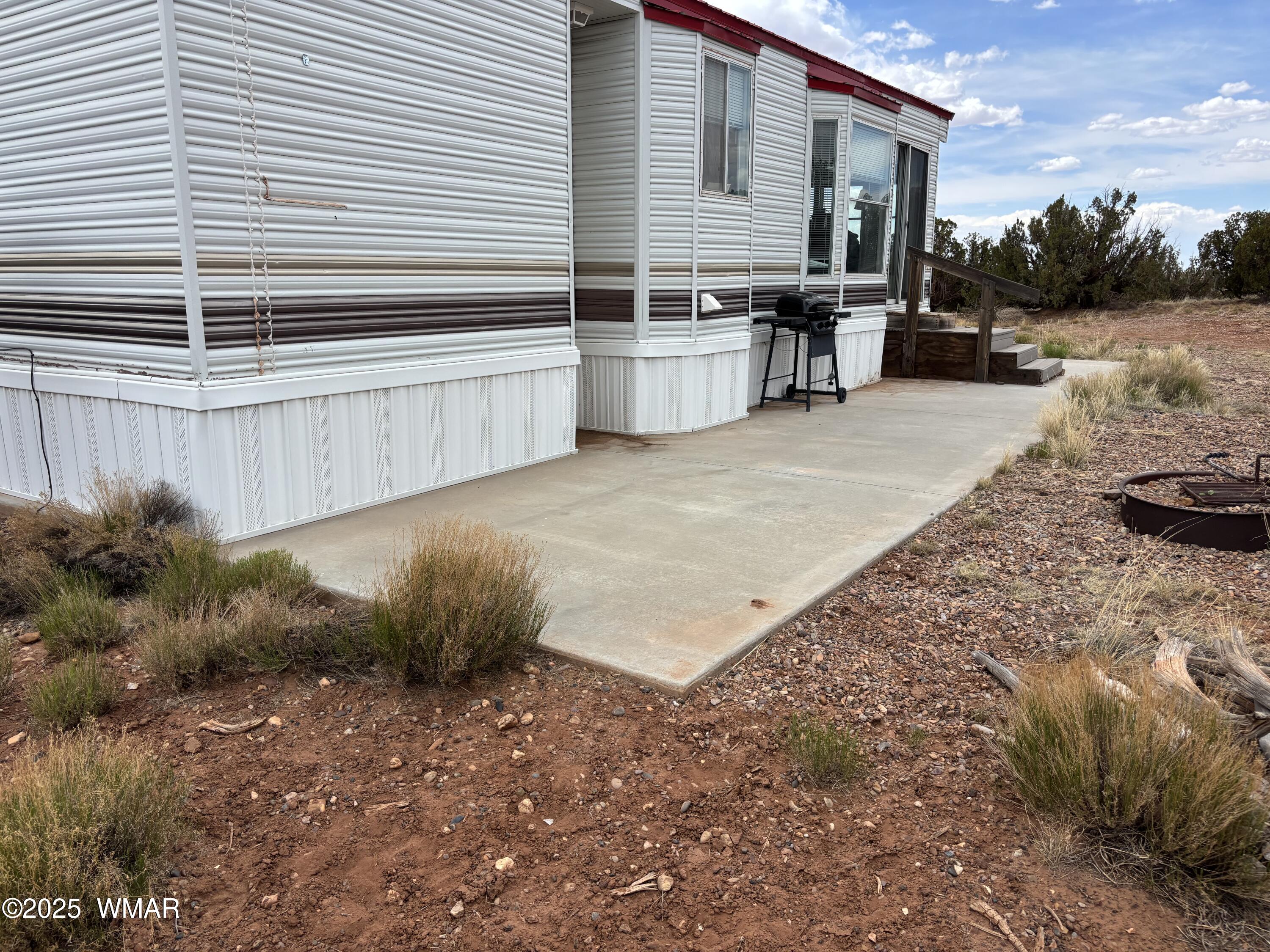 5233 Concho Ocho Road Snowflake, AZ 85937 - Photo 3 of 19 a backyard of a house with yard and outdoor seating