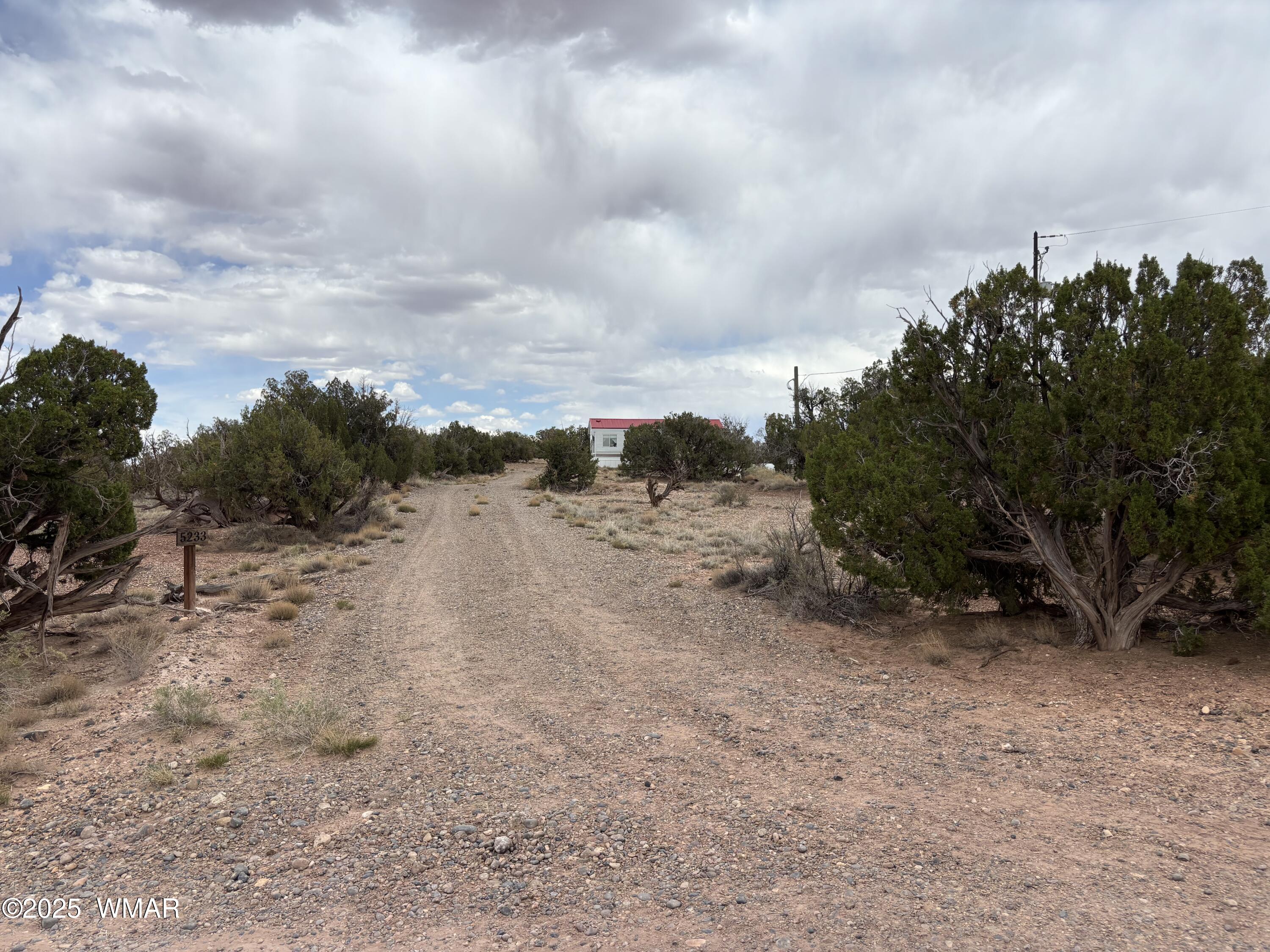 5233 Concho Ocho Road Snowflake, AZ 85937 - Photo 9 of 19 a view of a dry yard with wooden fence