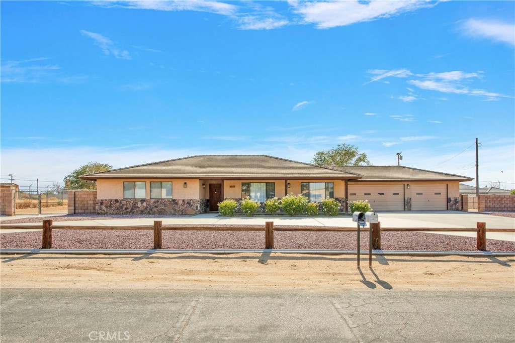 18301 Cocopah Road Apple Valley, CA 92307 - Photo 1 of 1 a view of yard with large tree
