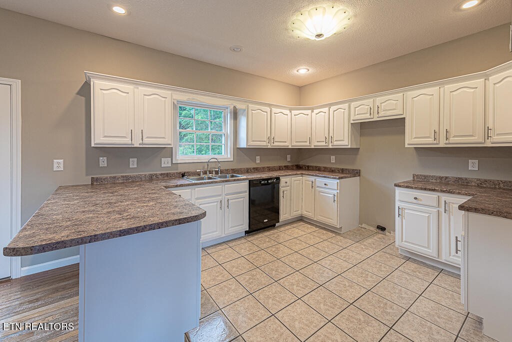 200 West Park Circle Decatur, TN 37322 - Photo 13 of 25 a kitchen with granite countertop a sink window and cabinets
