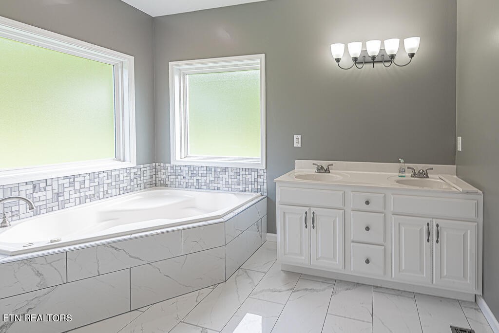 200 West Park Circle Decatur, TN 37322 - Photo 16 of 25 a bath room with a sink and a mirror