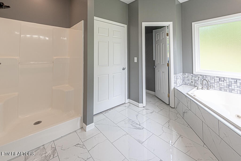 200 West Park Circle Decatur, TN 37322 - Photo 17 of 25 a spacious bathroom with a bathtub and a shower
