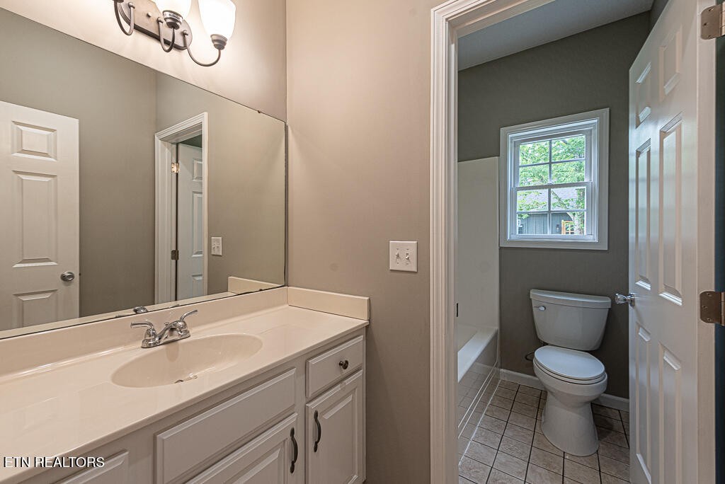 200 West Park Circle Decatur, TN 37322 - Photo 20 of 25 a bathroom with a toilet a sink and mirror