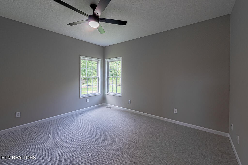 200 West Park Circle Decatur, TN 37322 - Photo 21 of 25 an empty room with a window and a fan