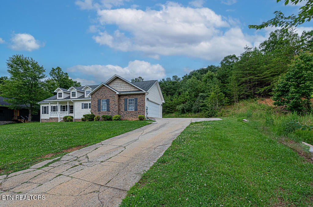 200 West Park Circle Decatur, TN 37322 - Photo 3 of 25 a front view of a house with a yard