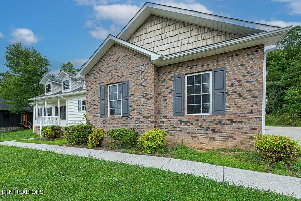 200 West Park Circle Decatur, TN 37322 - Photo 4 of 25 a front view of a house with garden