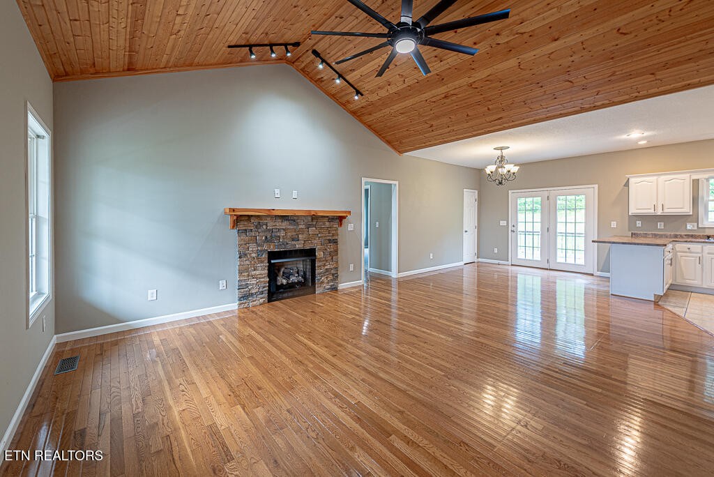 200 West Park Circle Decatur, TN 37322 - Photo 5 of 25 a view of empty room with wooden floor and fireplace