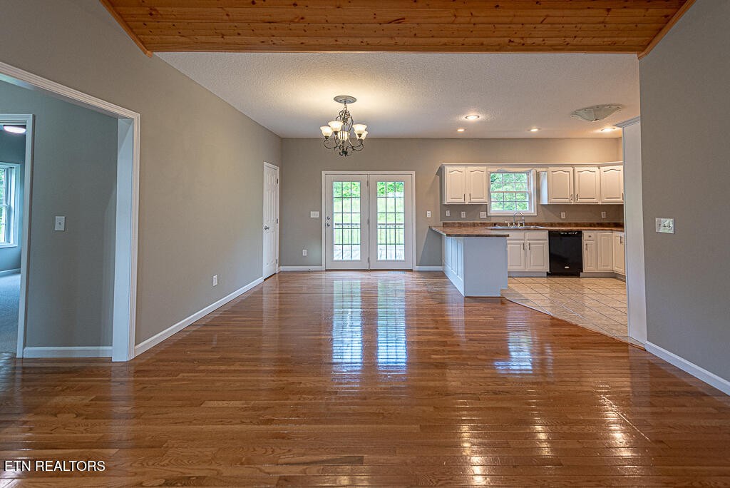 200 West Park Circle Decatur, TN 37322 - Photo 6 of 25 a view of kitchen with granite countertop window and wooden floor