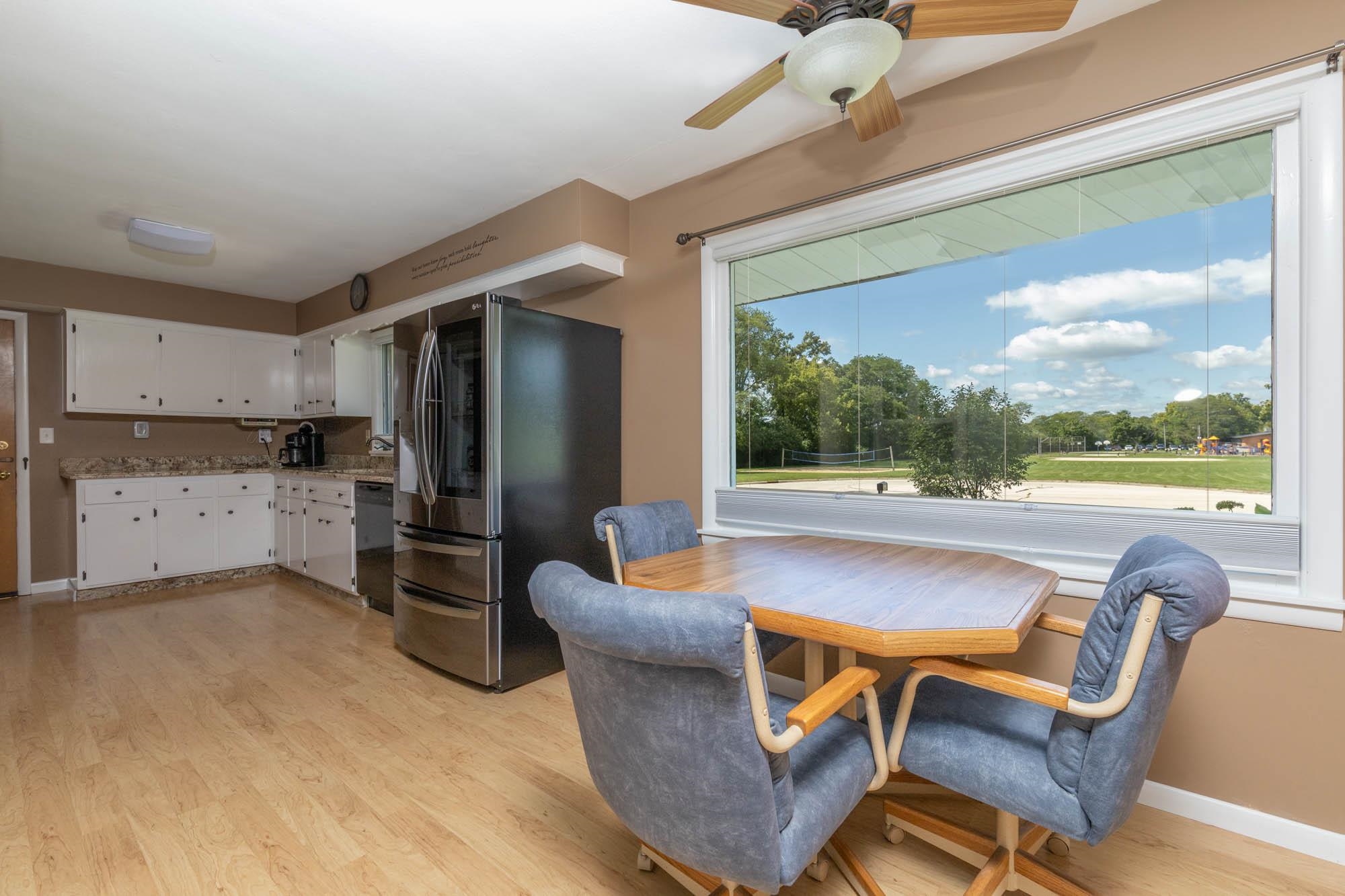 203 Wood Road Rockford, IL 61107 - Photo 11 of 32 a outdoor dining space with furniture and a kitchen view