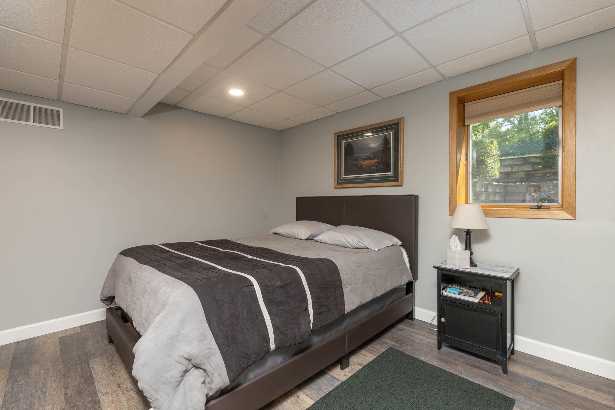 203 Wood Road Rockford, IL 61107 - Photo 23 of 32 a bedroom with a bed and a window