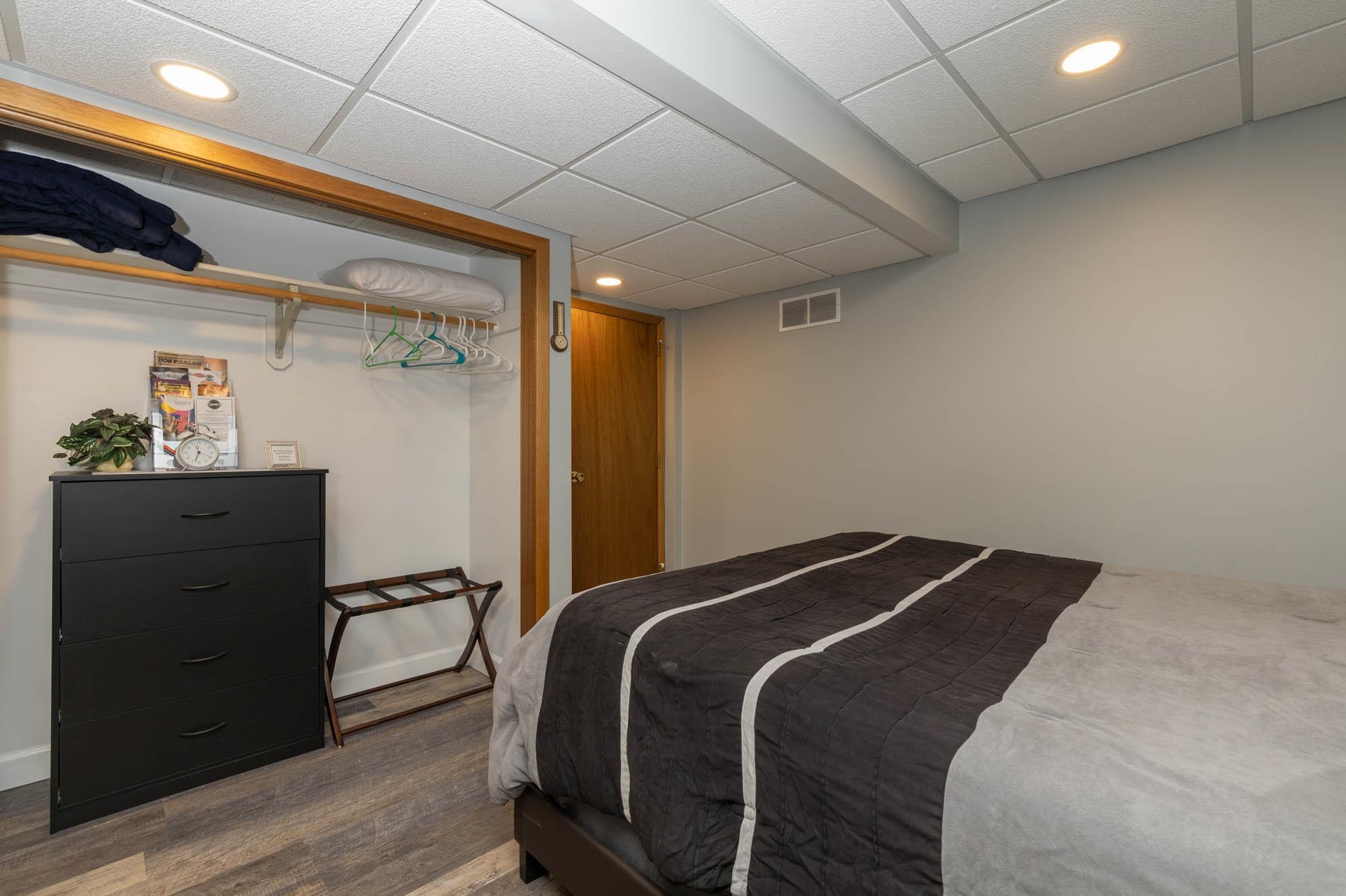 203 Wood Road Rockford, IL 61107 - Photo 24 of 32 a bedroom with a bed and a dresser
