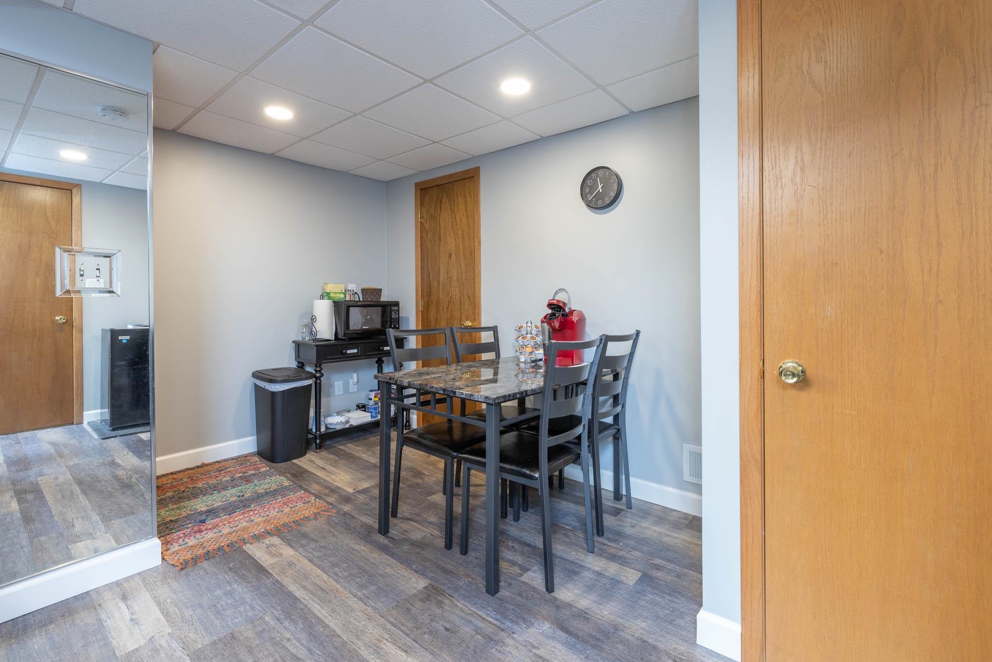 203 Wood Road Rockford, IL 61107 - Photo 26 of 32 a view of a dining room with furniture and wooden floor