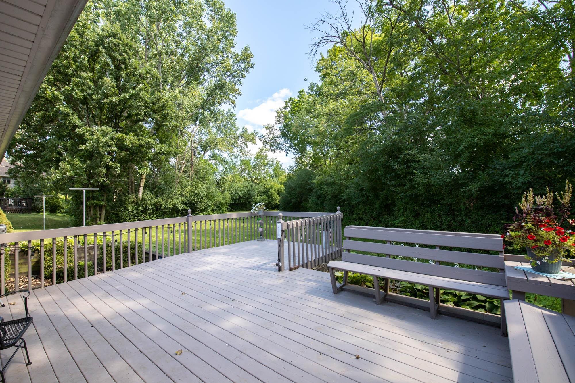 203 Wood Road Rockford, IL 61107 - Photo 28 of 32 a wooden bench sitting on top of a wooden floor