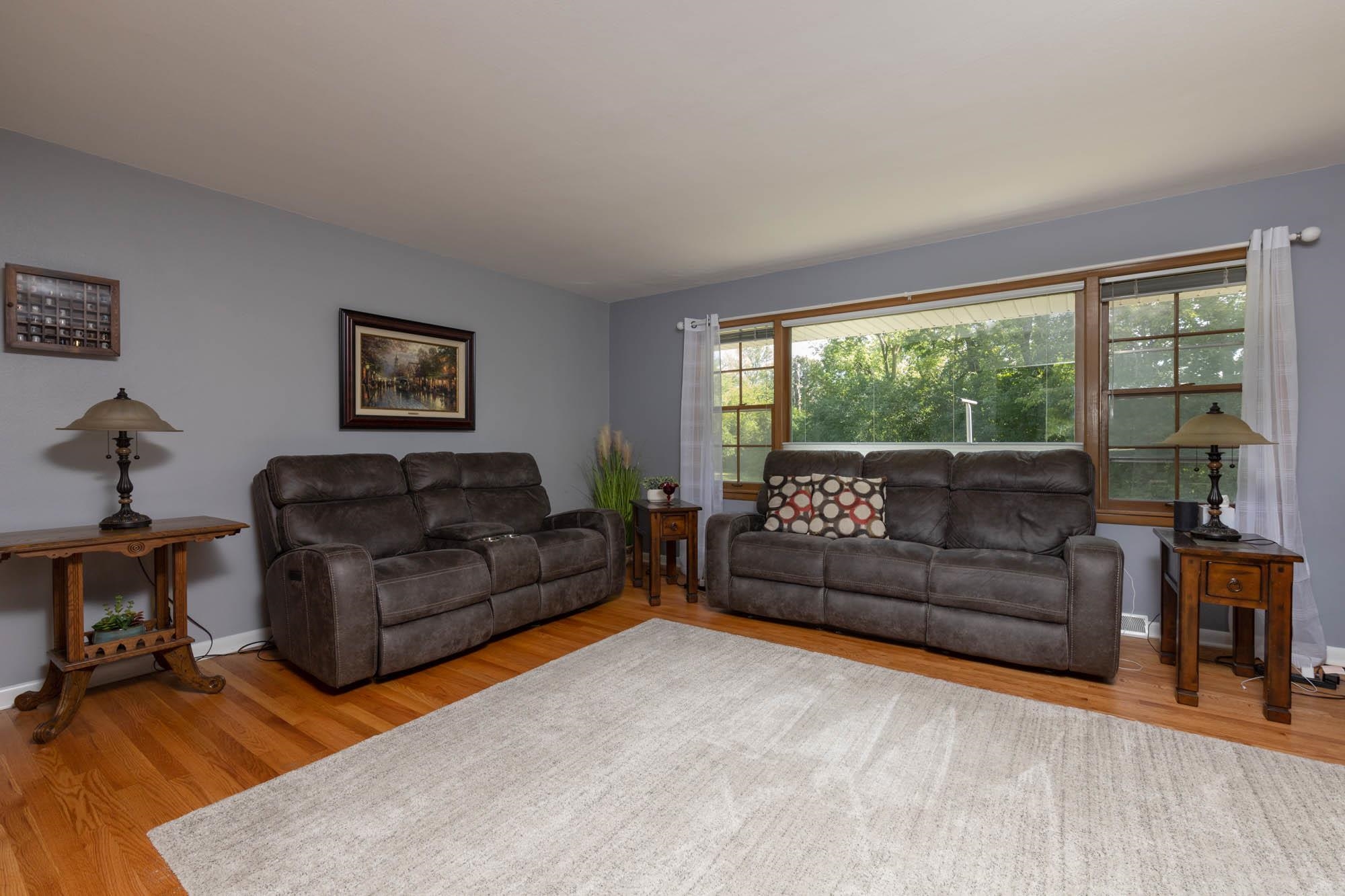 203 Wood Road Rockford, IL 61107 - Photo 6 of 32 a living room with furniture and a large window