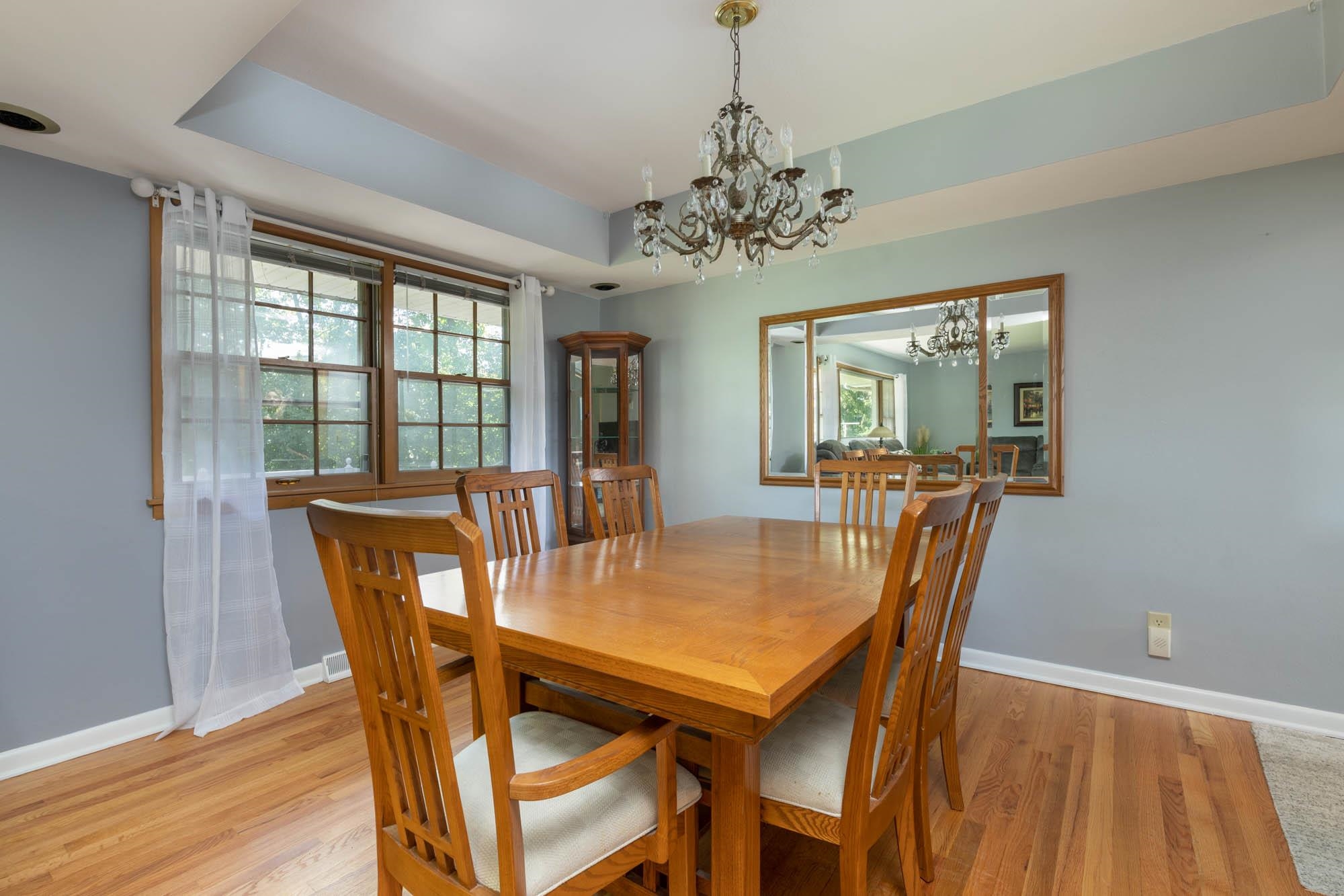 203 Wood Road Rockford, IL 61107 - Photo 7 of 32 a view of a dining room with furniture window and wooden floor