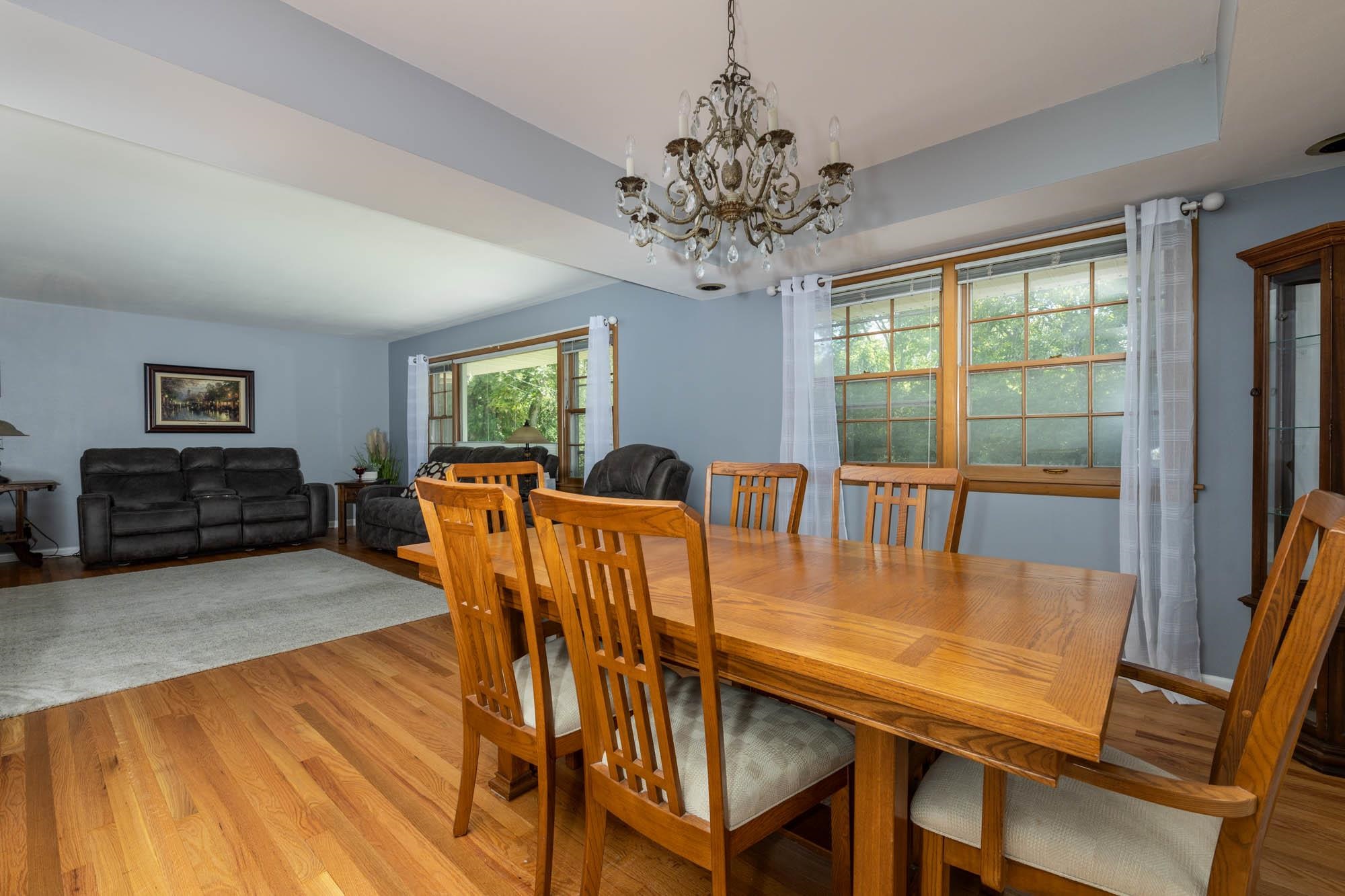 203 Wood Road Rockford, IL 61107 - Photo 8 of 32 a view of a dining room with furniture window and wooden floor