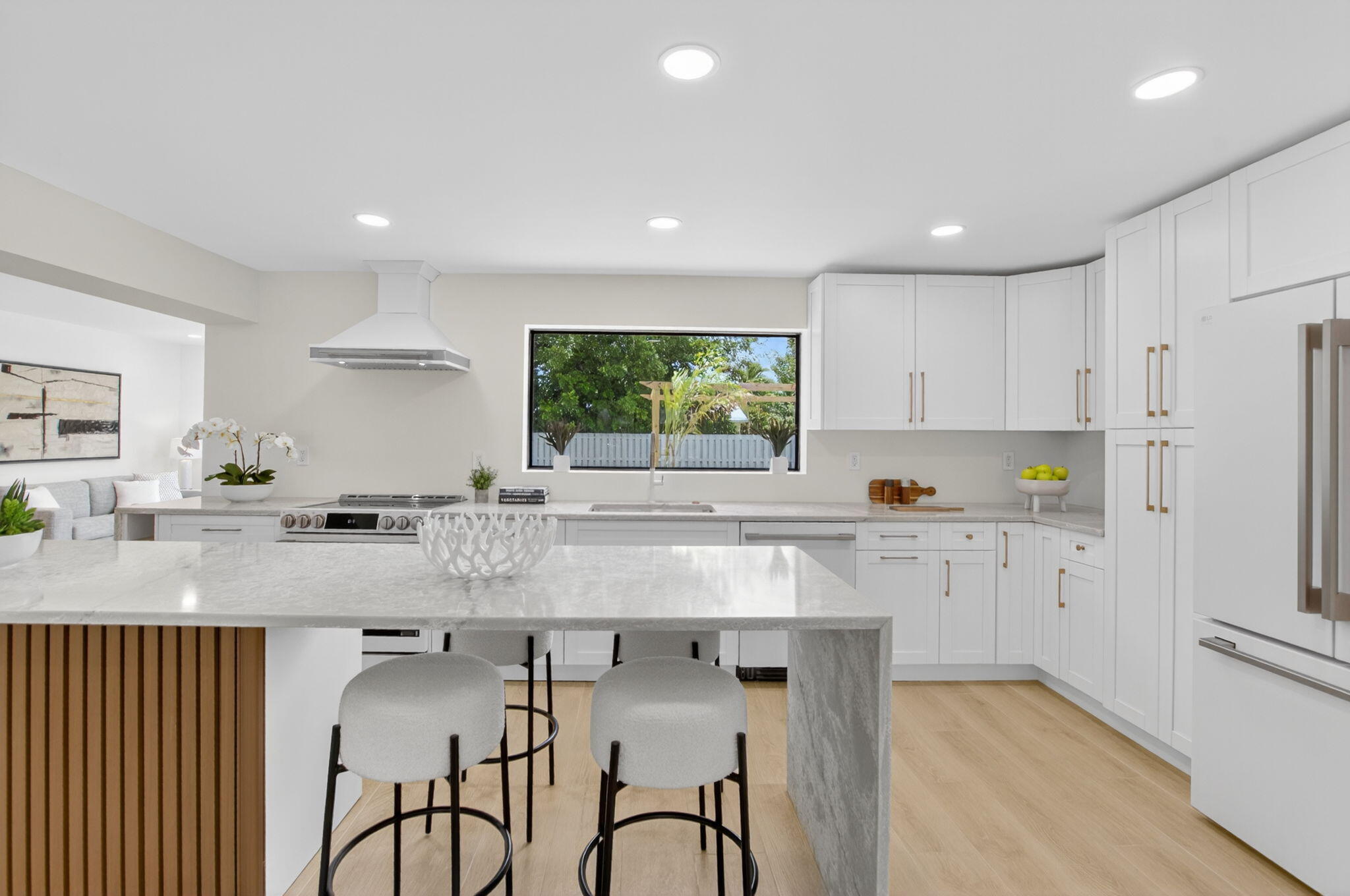 1780 Southwest 9th Street Boca Raton, FL 33486 - Photo 12 of 67 a kitchen with granite countertop white cabinets and window