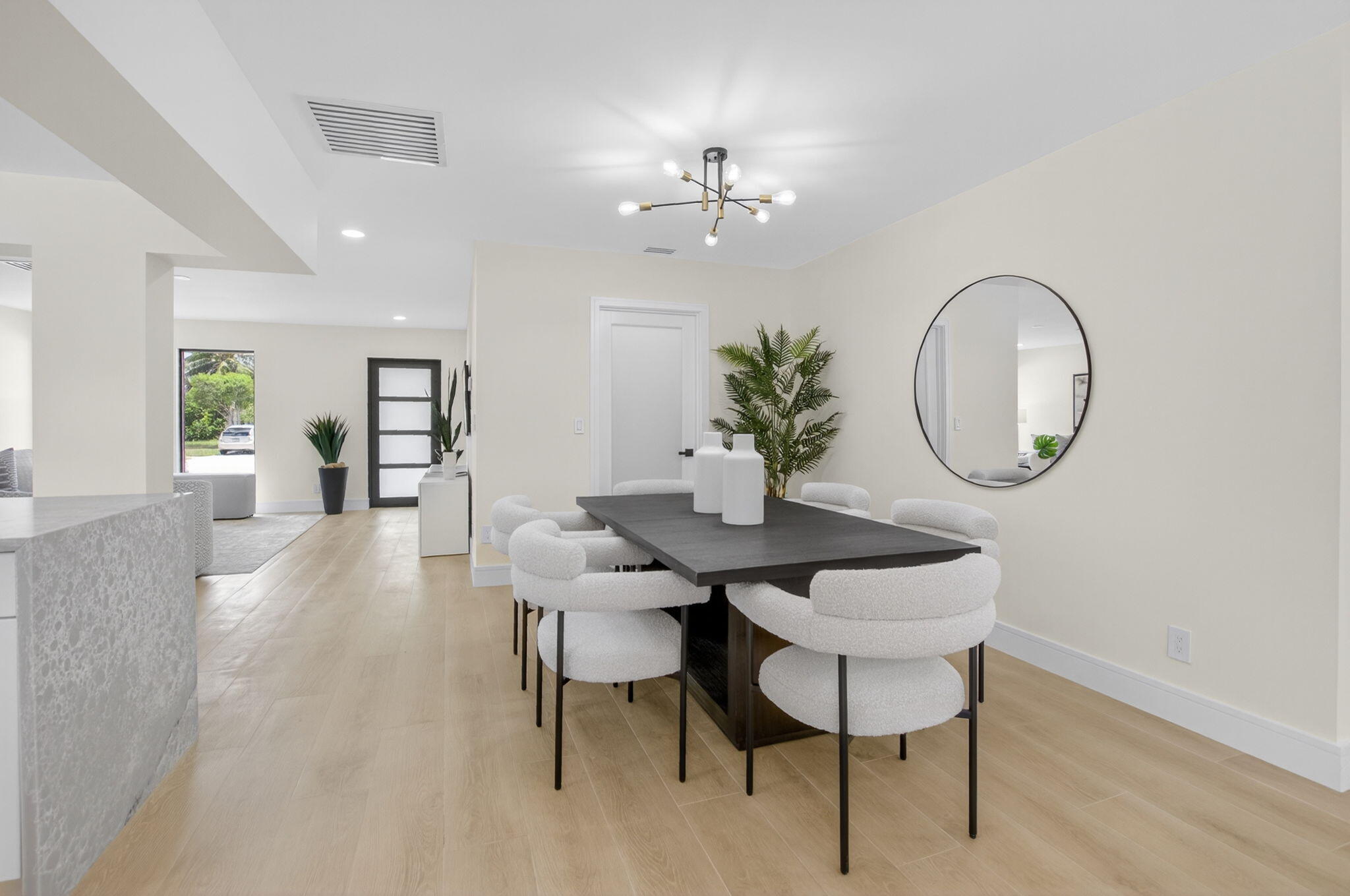 1780 Southwest 9th Street Boca Raton, FL 33486 - Photo 21 of 67 a view of a dining room with furniture and a chandelier
