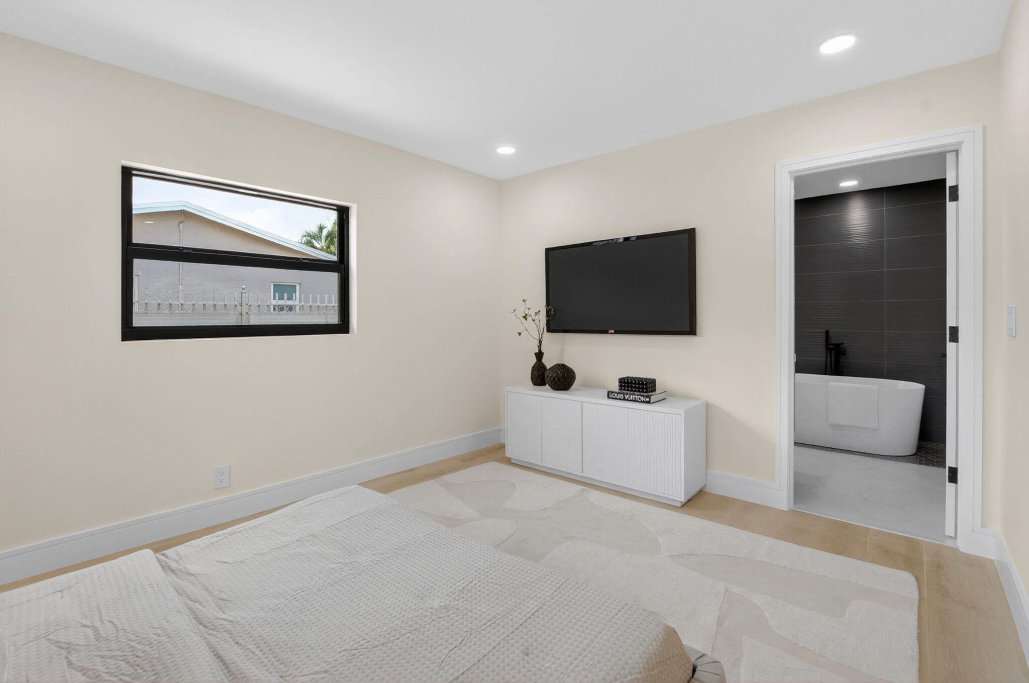 1780 Southwest 9th Street Boca Raton, FL 33486 - Photo 27 of 67 a view of a livingroom with a flat screen tv