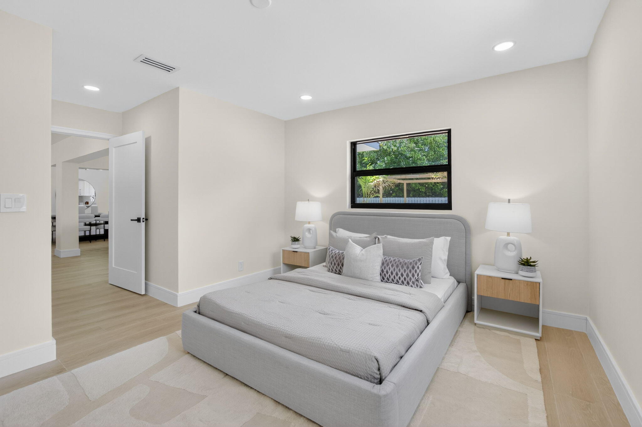 1780 Southwest 9th Street Boca Raton, FL 33486 - Photo 28 of 67 a bedroom with a bed and a painting on the wall