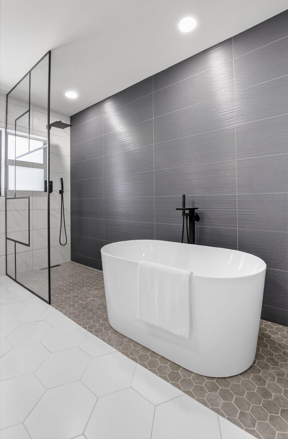 1780 Southwest 9th Street Boca Raton, FL 33486 - Photo 32 of 67 a white tub sitting in a bathroom