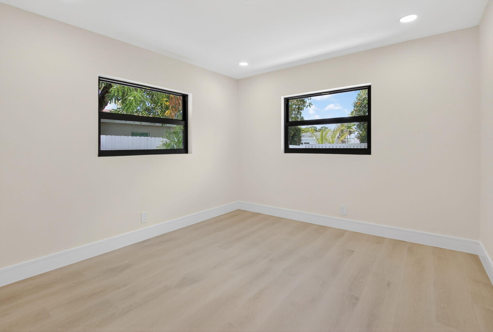 1780 Southwest 9th Street Boca Raton, FL 33486 - Photo 36 of 67 an empty room with a painting on the wall