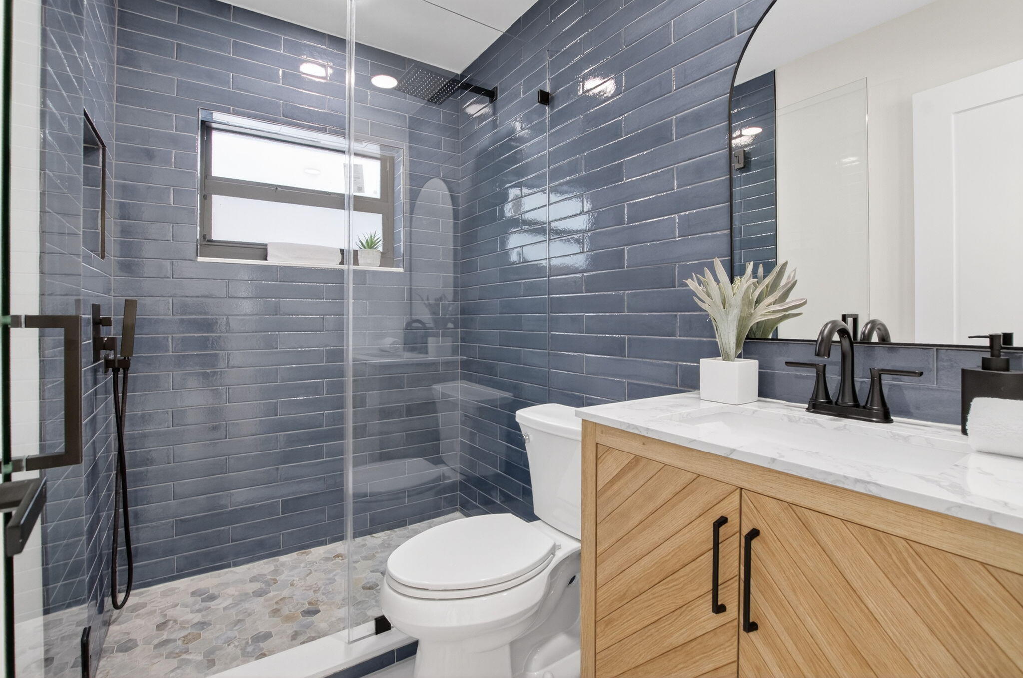 1780 Southwest 9th Street Boca Raton, FL 33486 - Photo 38 of 67 a bathroom with a sink a toilet and shower