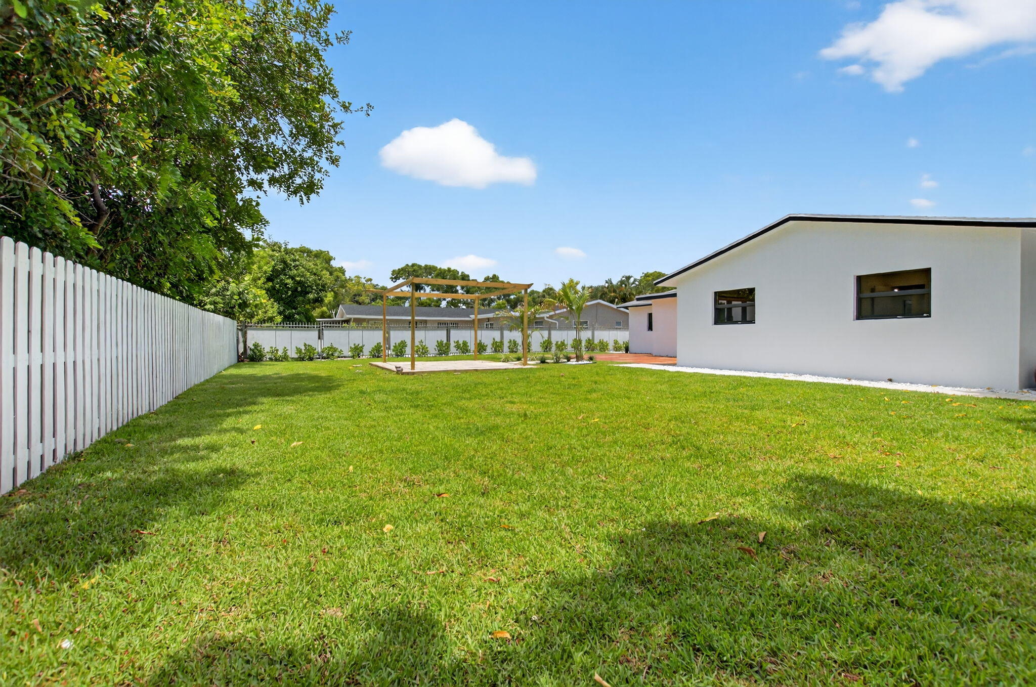 1780 Southwest 9th Street Boca Raton, FL 33486 - Photo 43 of 67 a view of an house with backyard space and balcony