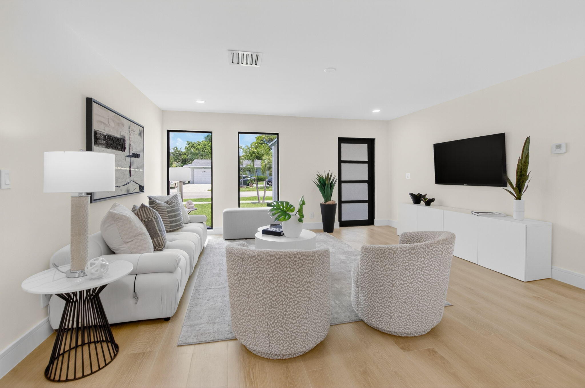 1780 Southwest 9th Street Boca Raton, FL 33486 - Photo 5 of 67 a living room with furniture and a flat screen tv