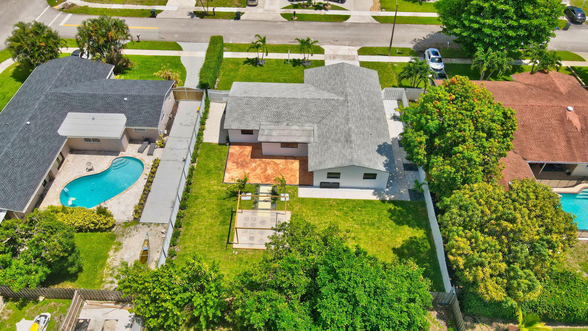 1780 Southwest 9th Street Boca Raton, FL 33486 - Photo 63 of 67 an aerial view of a house with swimming pool yard and outdoor seating