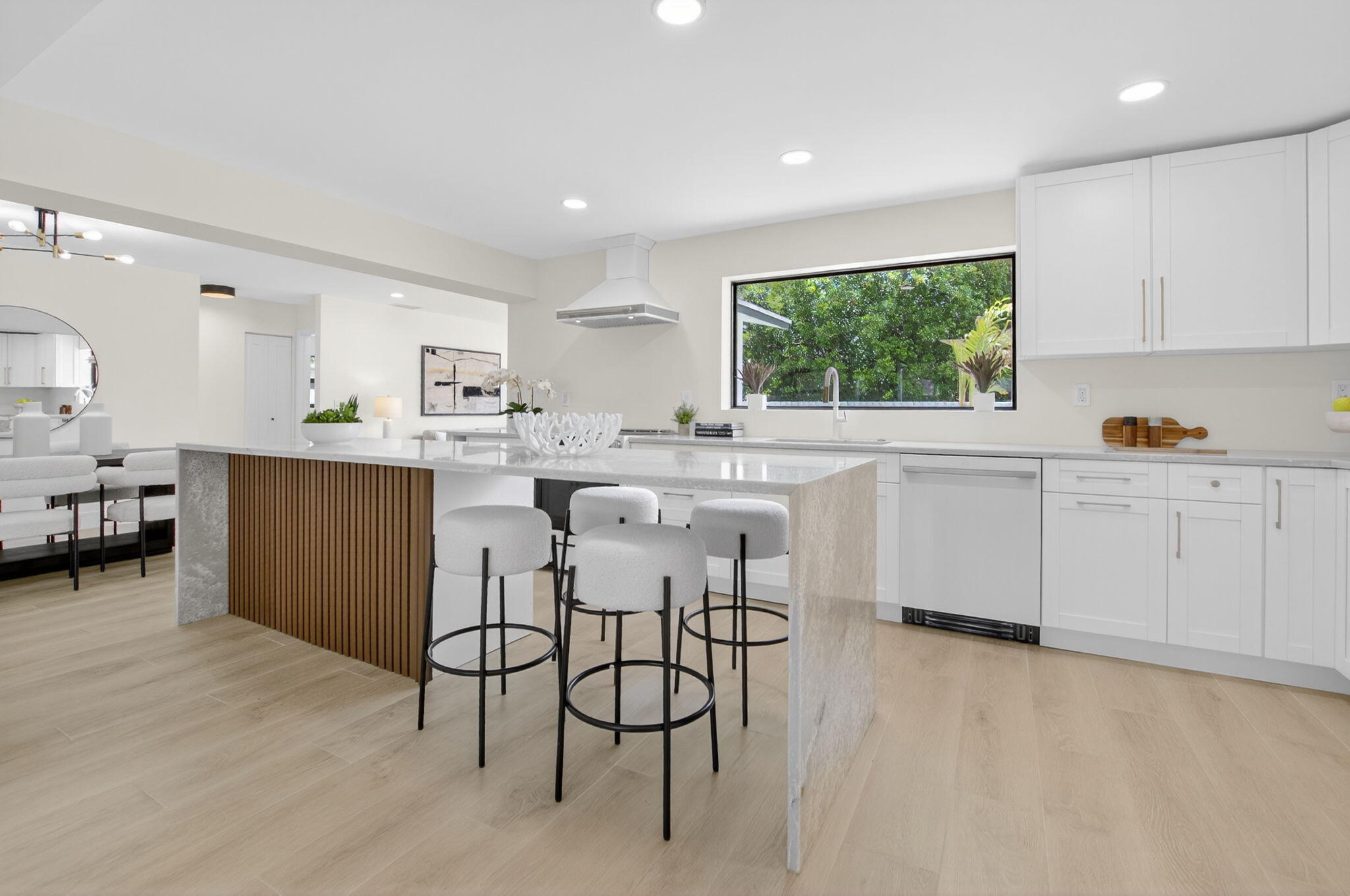 1780 Southwest 9th Street Boca Raton, FL 33486 - Photo 8 of 67 a kitchen with stainless steel appliances a microwave a stove a sink dishwasher and cabinets with wooden floor