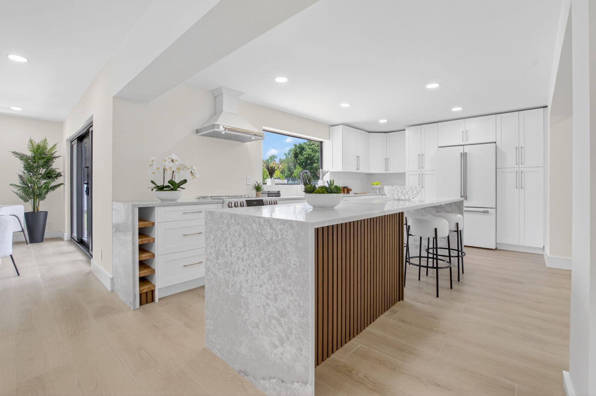 1780 Southwest 9th Street Boca Raton, FL 33486 - Photo 9 of 67 a kitchen with stainless steel appliances kitchen island granite countertop a refrigerator and a sink