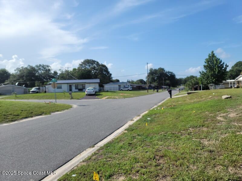 1700 Chaucer Road Titusville, FL 32780 - Photo 3 of 15 a view of a golf course with a lake