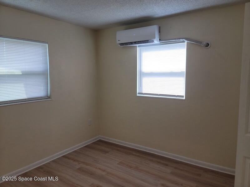 1700 Chaucer Road Titusville, FL 32780 - Photo 9 of 15 an empty room with a window