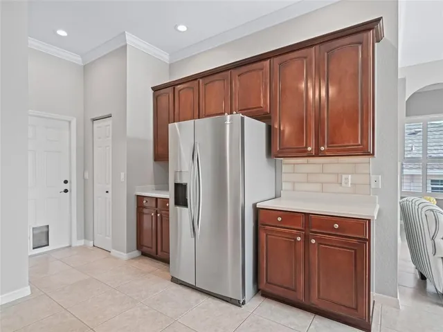 a kitchen with a sink cabinets and window