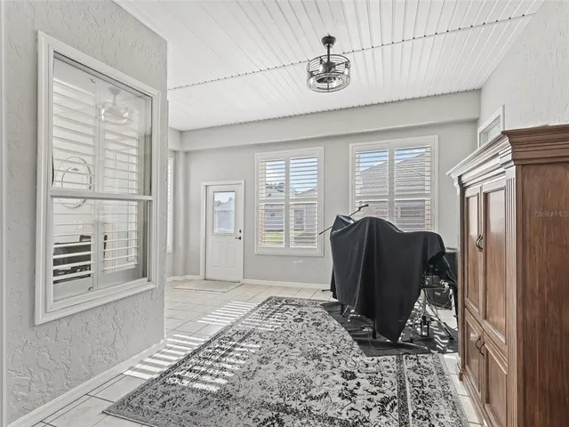 a view of a entryway with furniture and floor to ceiling window