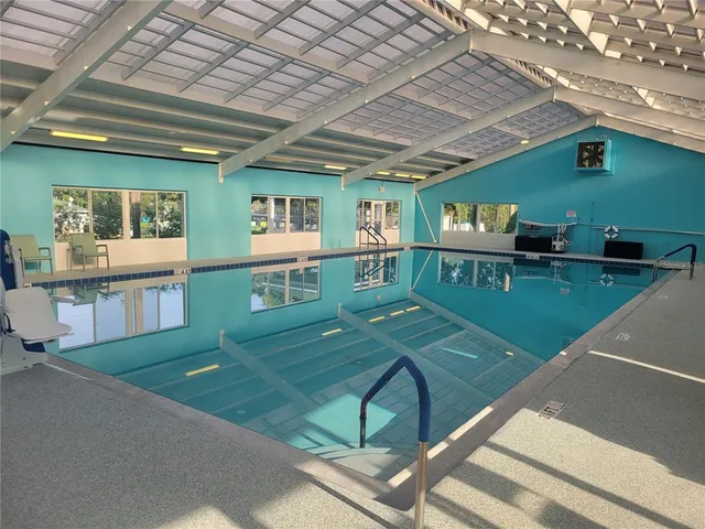 a view of walk in closet with clothes