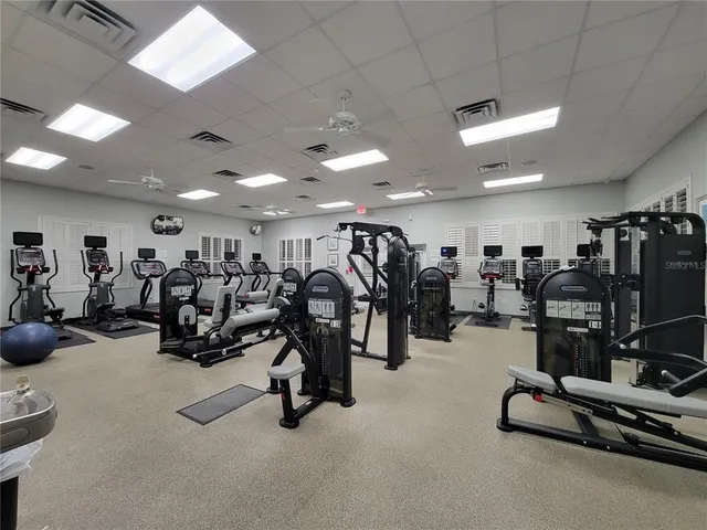 a view of a swimming pool and lounge chairs