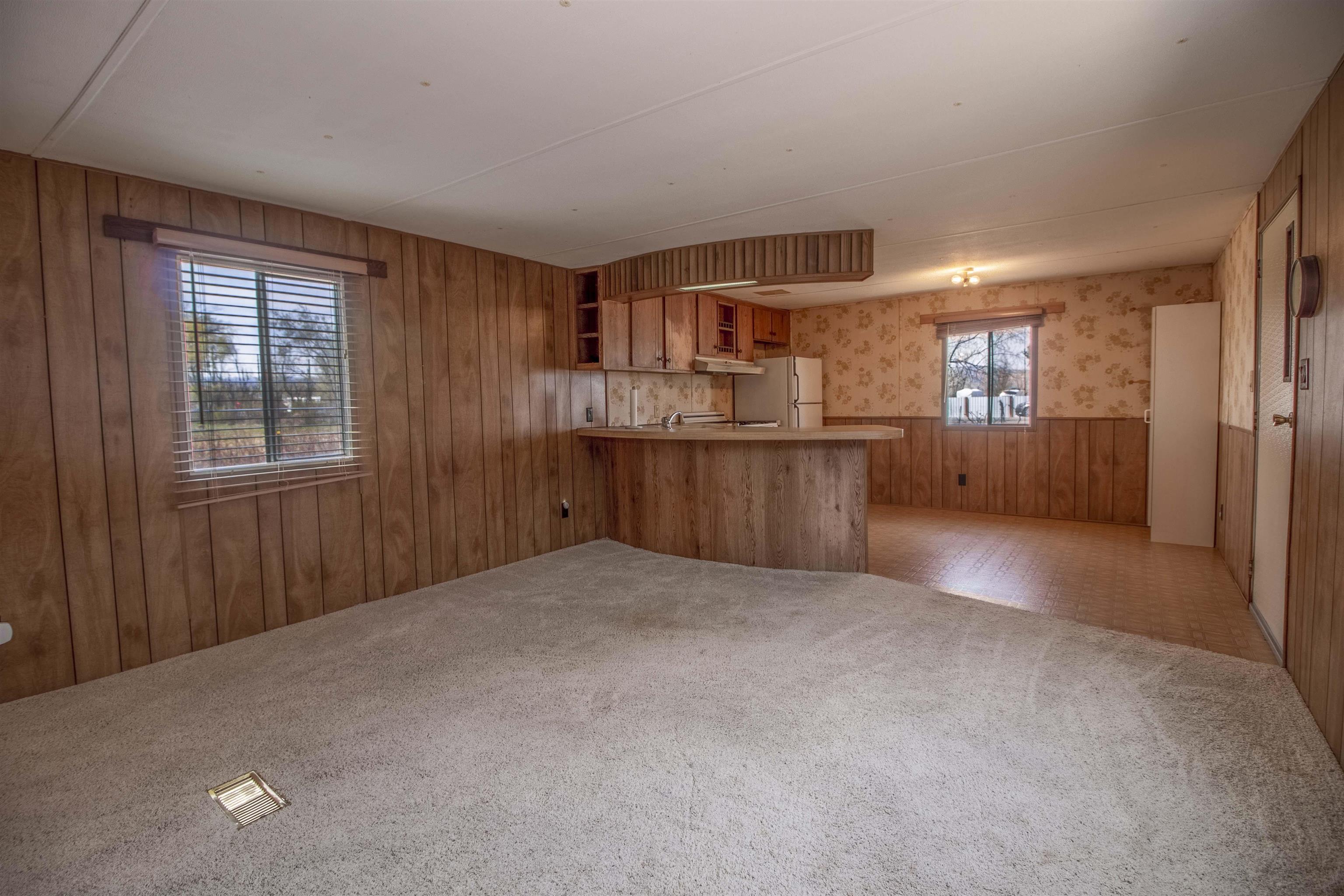 808 24 Road Grand Junction, CO 81505 - Photo 14 of 23 a view of empty room with kitchen and window