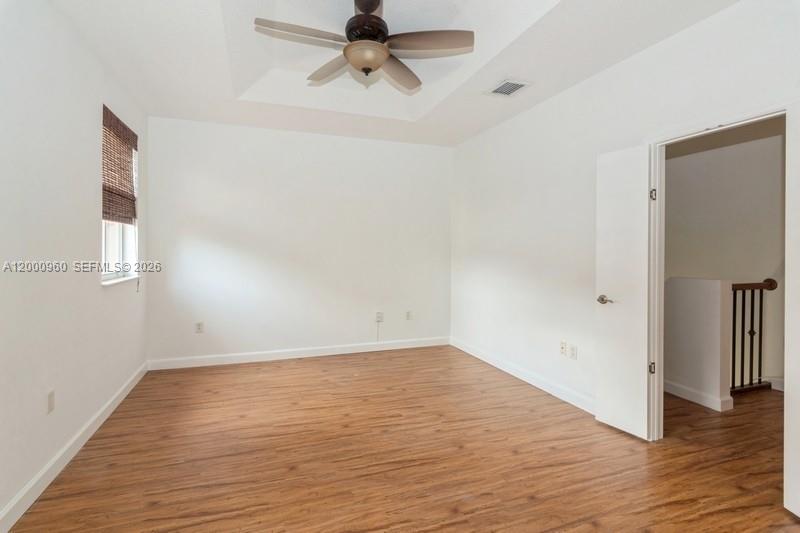 10884 Southwest 89th Street Miami, FL 33176 - Photo 4 of 10 wooden floor in an empty room