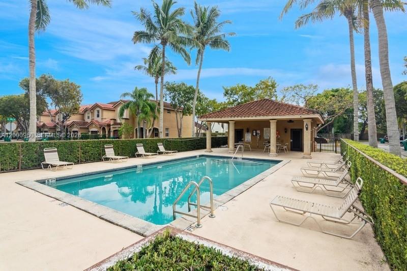 10884 Southwest 89th Street Miami, FL 33176 - Photo 10 of 10 a view of a house with a swimming pool and a yard