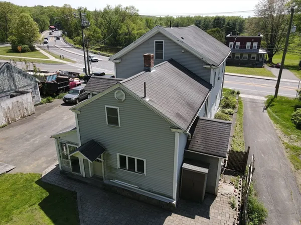 a aerial view of a house with a yard