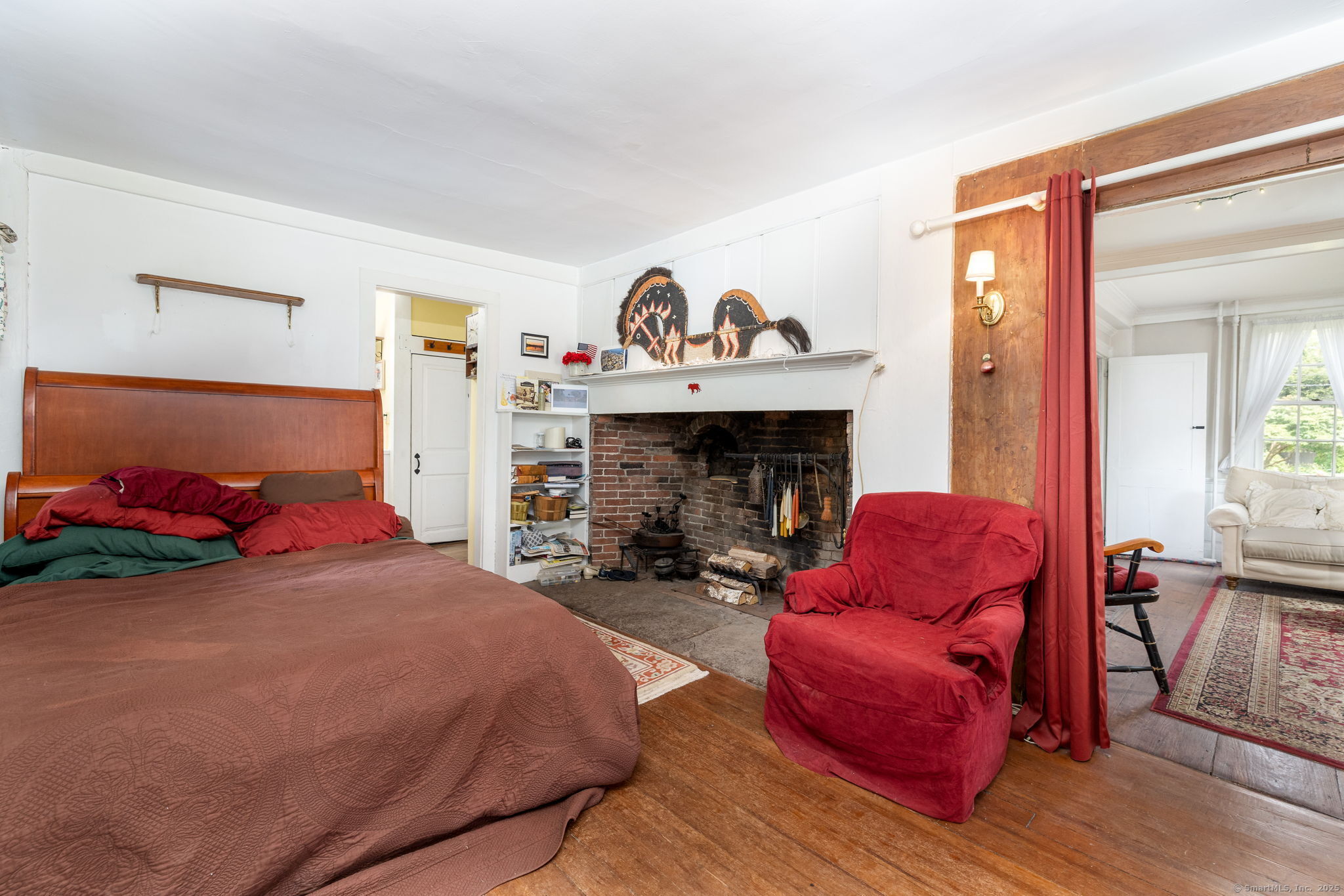 493 Main Street Wethersfield, CT 06109 - Photo 11 of 40 a bedroom with furniture and a fireplace