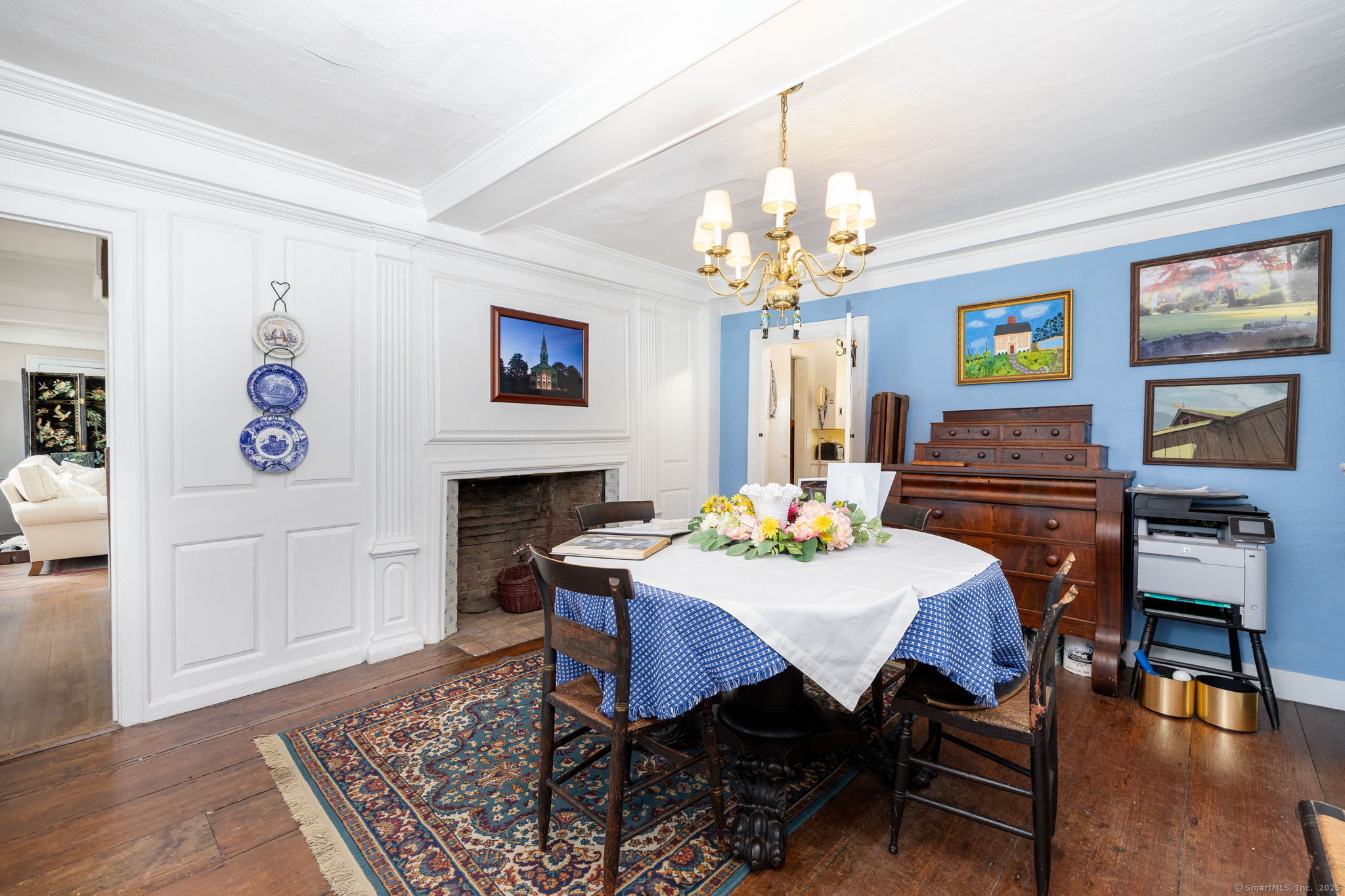 493 Main Street Wethersfield, CT 06109 - Photo 13 of 40 a view of a dining room with furniture wooden floor and a chandelier