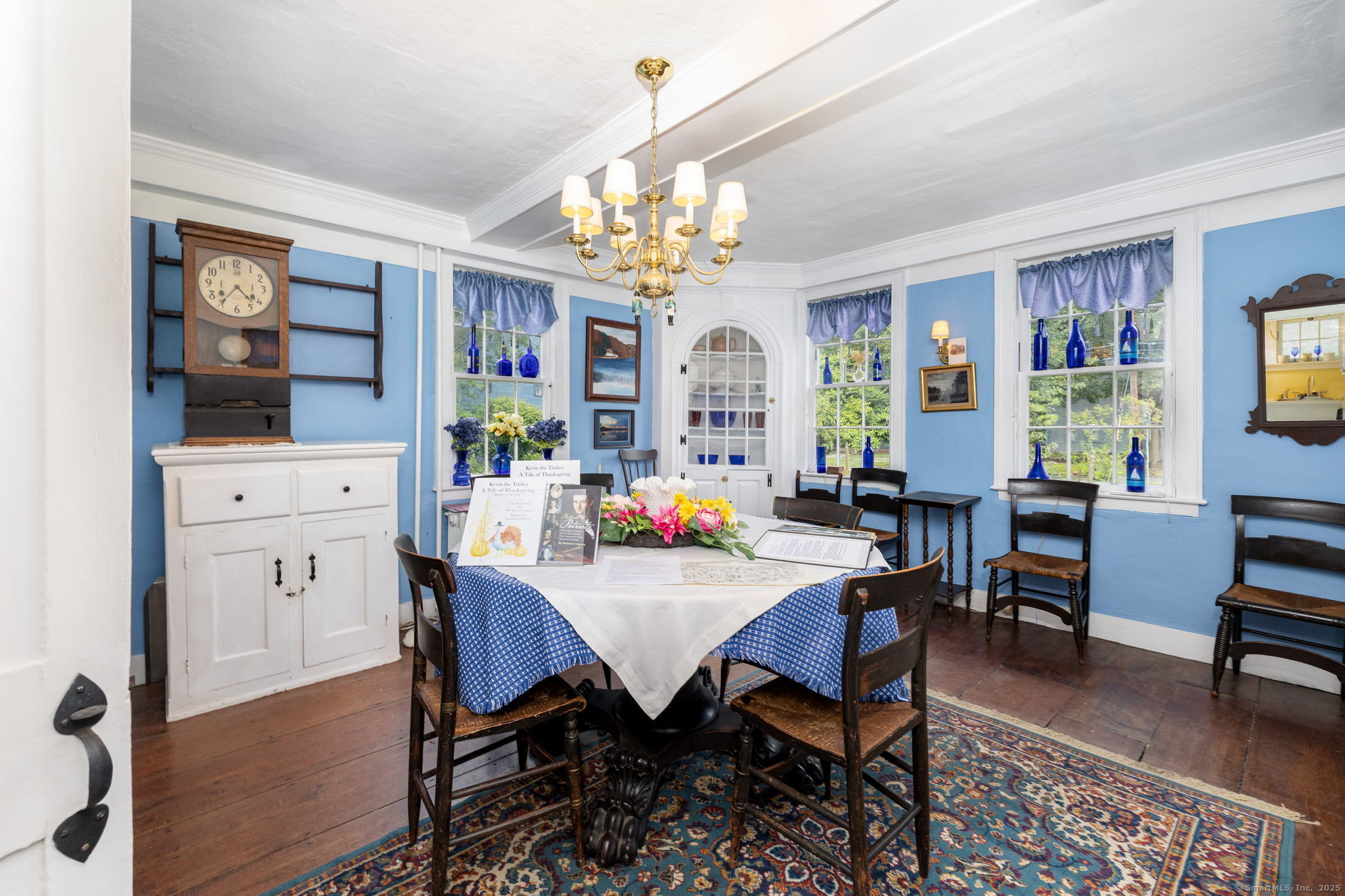 493 Main Street Wethersfield, CT 06109 - Photo 15 of 40 a view of a dining room with furniture and a chandelier