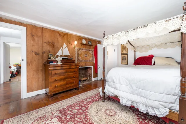 a bedroom with a bed and a walk in closet