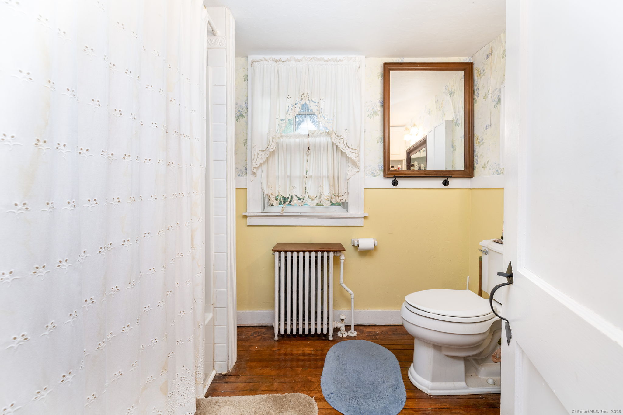 493 Main Street Wethersfield, CT 06109 - Photo 26 of 40 a bathroom with a toilet a sink and a mirror