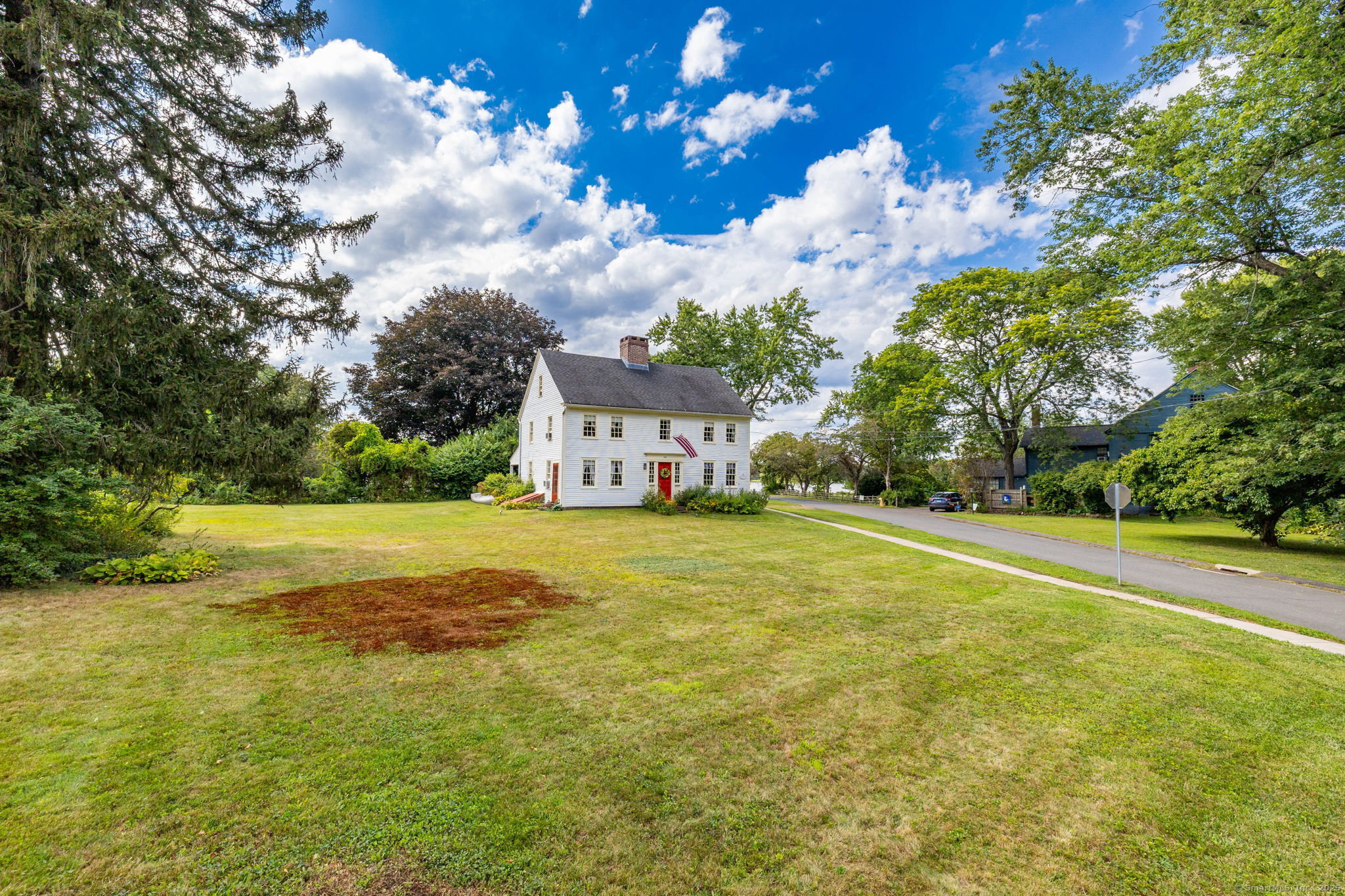 493 Main Street Wethersfield, CT 06109 - Photo 3 of 40 a swimming pool with trees in the background